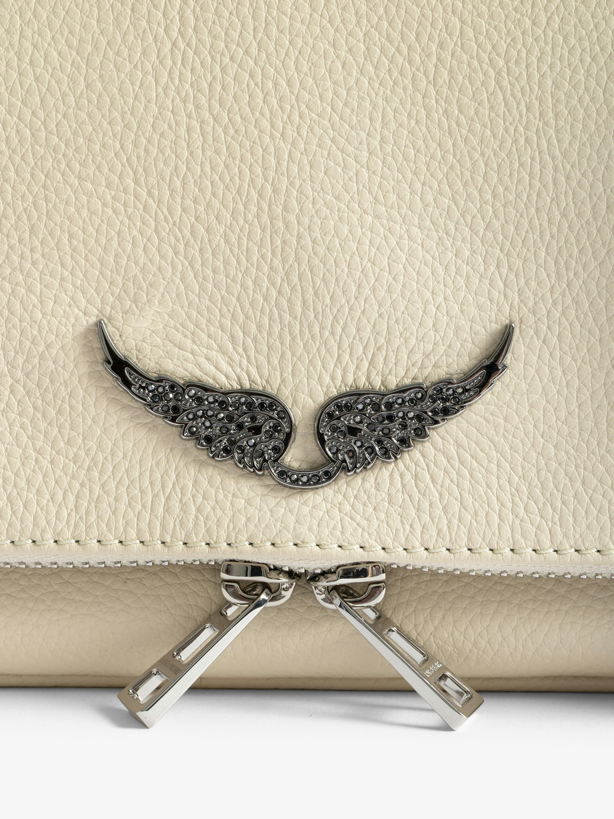 Rock Clutch - Clutch in grained leather with double leather and metal chains and wings adorned with rhinestones.